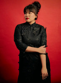 A woman dressed in Black Ying Gu Cheongsam Butterfly Lace Dress