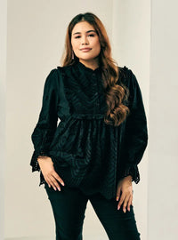 A woman dressed in Black Ezzah Eyelet Doll Top