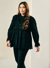 A woman dressed in Black Ezzah Eyelet Doll Top