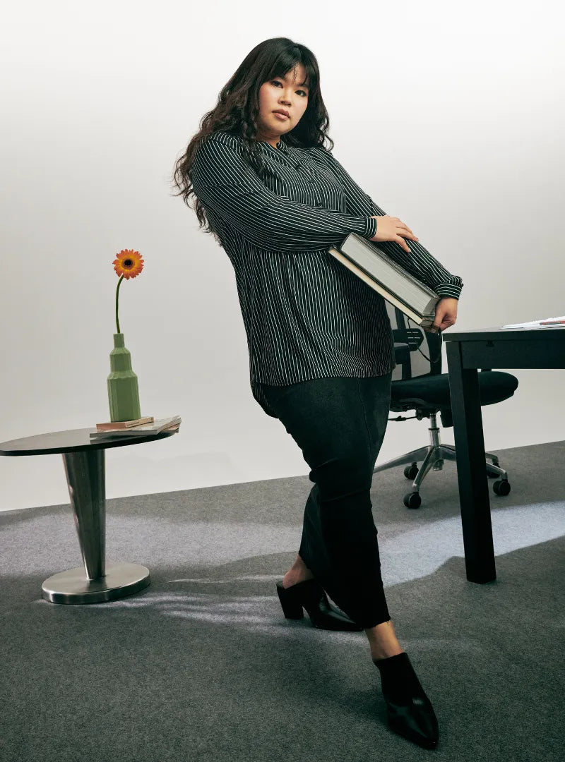 A woman dressed in Black and White Mandarin Collar Striped Polo Shirt