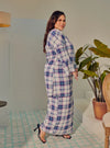 A woman dressed in Blue Atuk Tun Zainab Vintage Checked Kurung