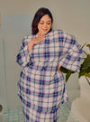 A woman dressed in Blue Atuk Tun Zainab Vintage Checked Kurung