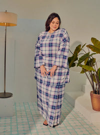 A woman dressed in Blue Atuk Tun Zainab Vintage Checked Kurung