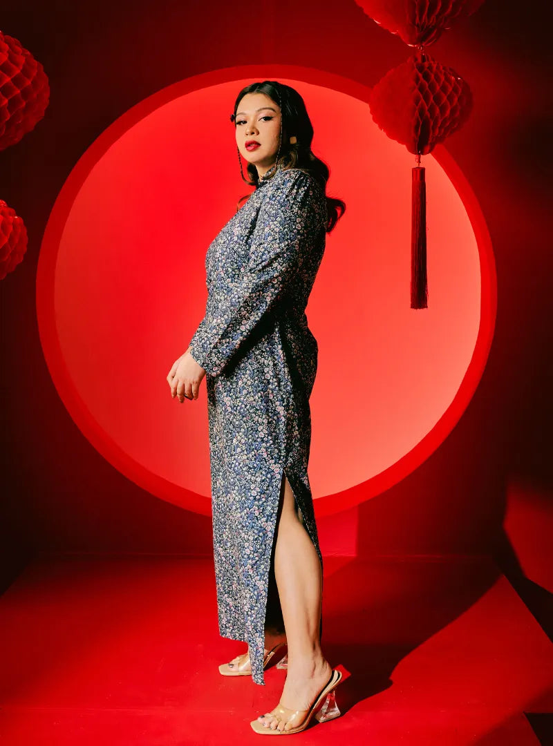 A woman dressed in Blue Breath Yun Jie Cheongsam Dress