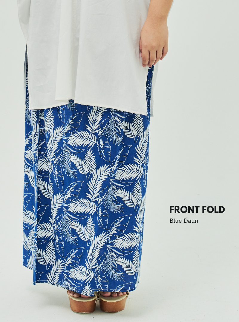 A woman dressed in Blue Daun Front Fold Songket Skirt