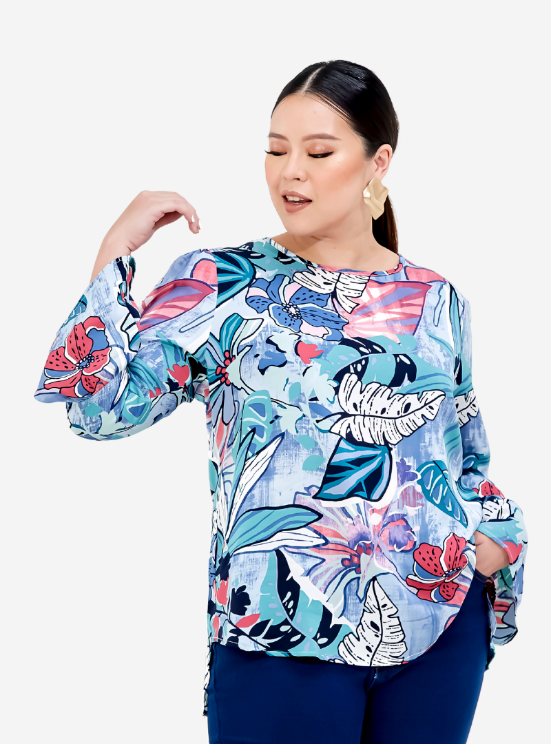 A woman dressed in Blue Pisang Tropical Top