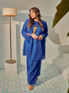 A woman dressed in Blue Tun Inna Kurung