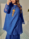 A woman dressed in Blue Tun Inna Kurung