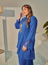 A woman dressed in Blue Tun Inna Kurung