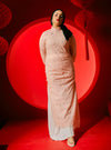 A woman dressed in Blush Pink Dai Gu Cheongsam Midi Dress