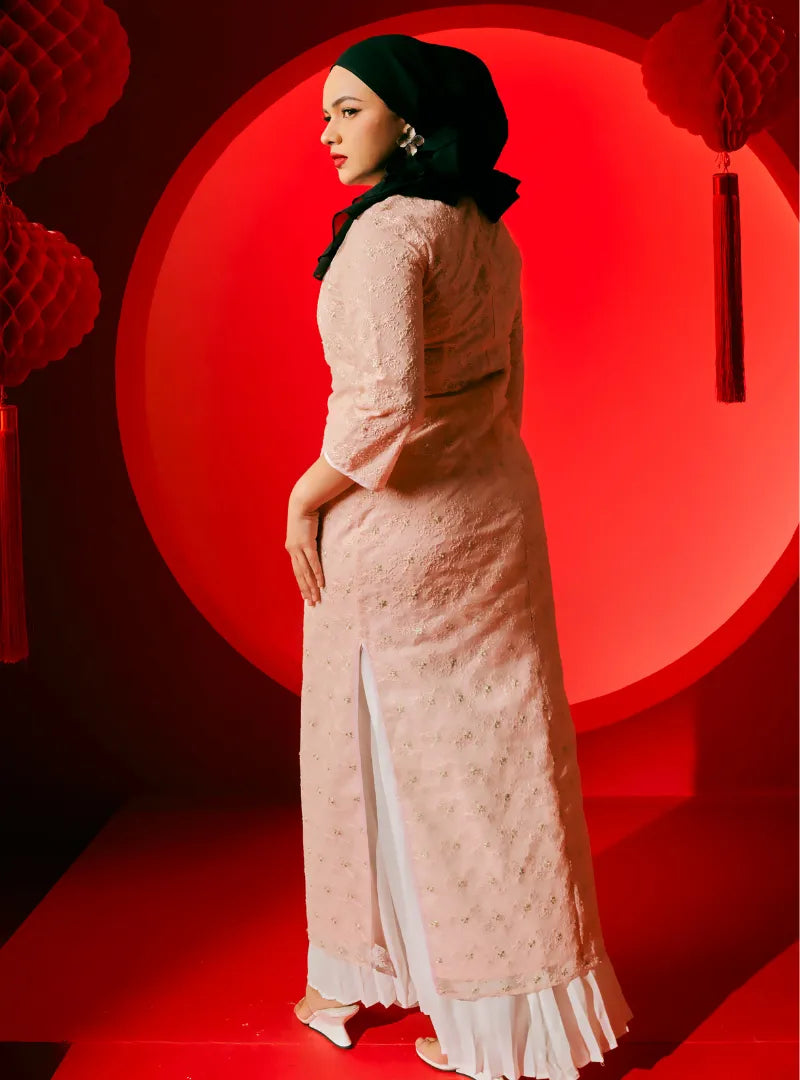 A woman dressed in Blush Pink Dai Gu Cheongsam Midi Dress