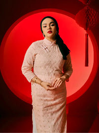 A woman dressed in Blush Pink Dai Gu Cheongsam Midi Dress