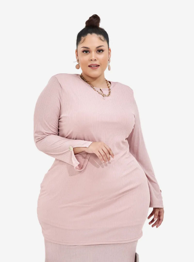 A woman dressed in Blush Pink Khatijah Bodycon Kurung