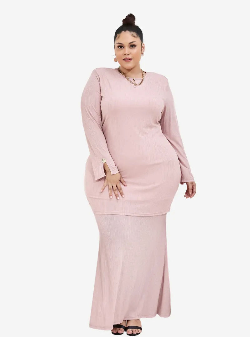 A woman dressed in Blush Pink Khatijah Bodycon Kurung