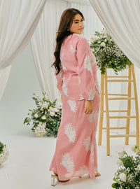 A woman dressed in Bombshell Tun Iman Mandarin Kurung