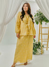  A woman dressed in Butter Tun Anisah Kebaya Kurung