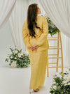  A woman dressed in Butter Tun Anisah Kebaya Kurung