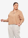 A woman dressed in Coffee Cropped Shirt