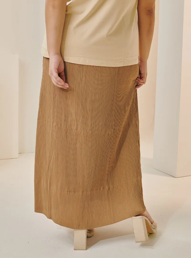 A woman wearing in Camel Tun Izzah Pleated Skirt