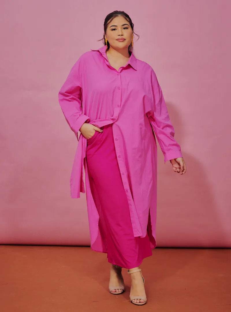 A woman dressed in Candy Pink Longline Oversized Cotton Shirt Dress