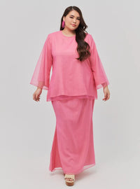 A woman dressed in Candy Pink Tun Aminah Organza Basic Kurung