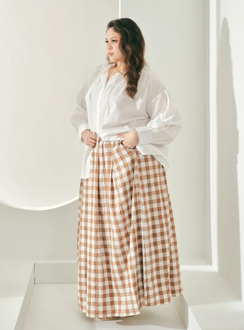 A woman wearing Caramel Jane Checked Skirt