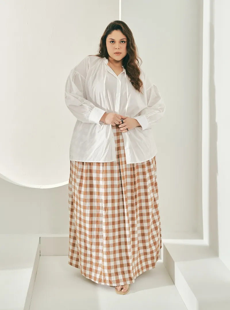 A woman wearing Caramel Jane Checked Skirt