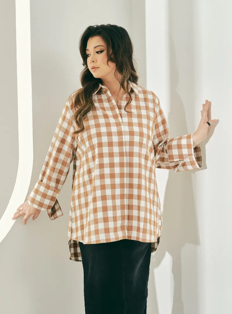 A woman dressed in Caramel Jennie Oversized Checked Cotton Shirts