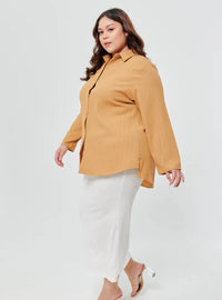 A woman dressed in Caramel Textured Shirt