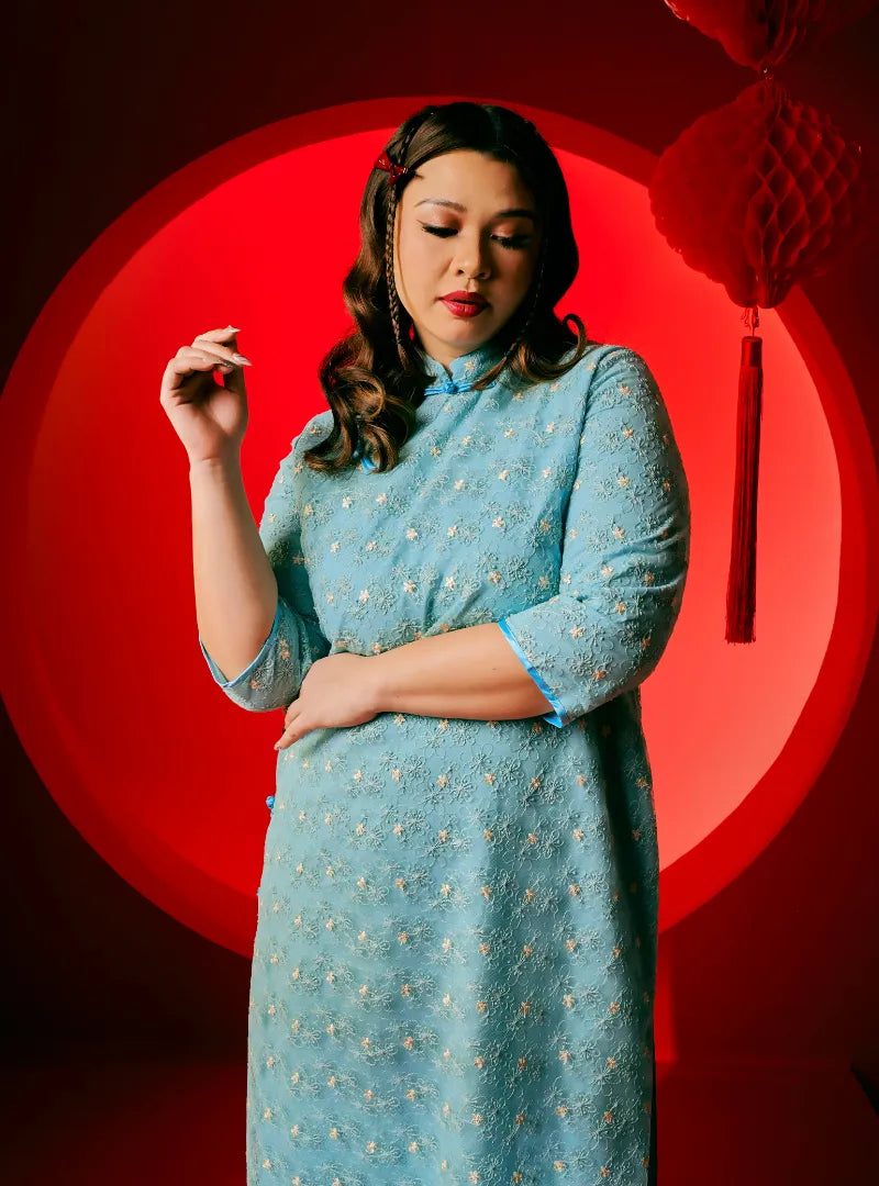 A woman dressed in Columbia Dai Gu Cheongsam Midi Dress