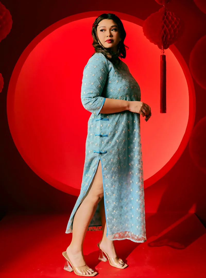 A woman dressed in Columbia Dai Gu Cheongsam Midi Dress