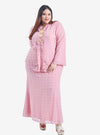 A woman wearing Dusty Pink Misha Kurung