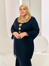 A woman dressed in Dark Blue Tun Sharimah Organza Kurung