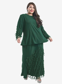 A woman dressed in Dark Teal Lalang Feather Kurung