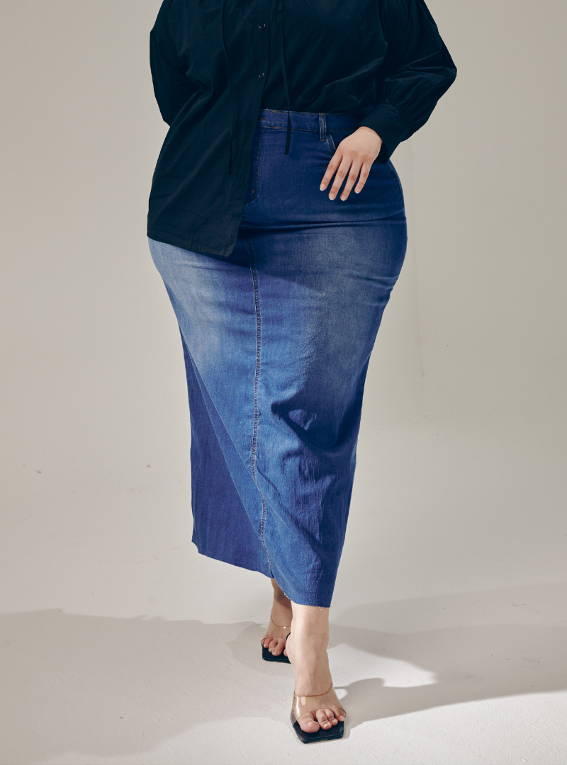 A woman wearing in Denim Blue Tasha Denim Long Skirt