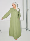 A woman dressed in Dusty Green Marsya Cotton Long Sleeve Dress