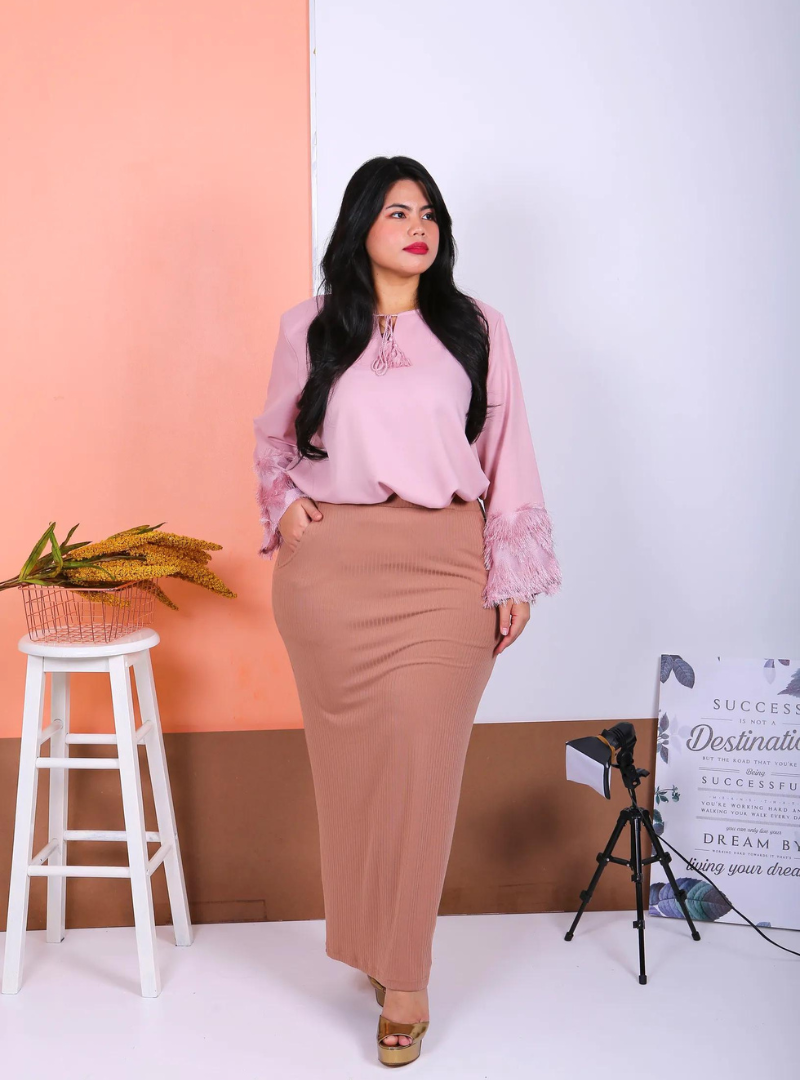 A woman dressed in Dusty Pink Fulu Fulu Kedah Top Only