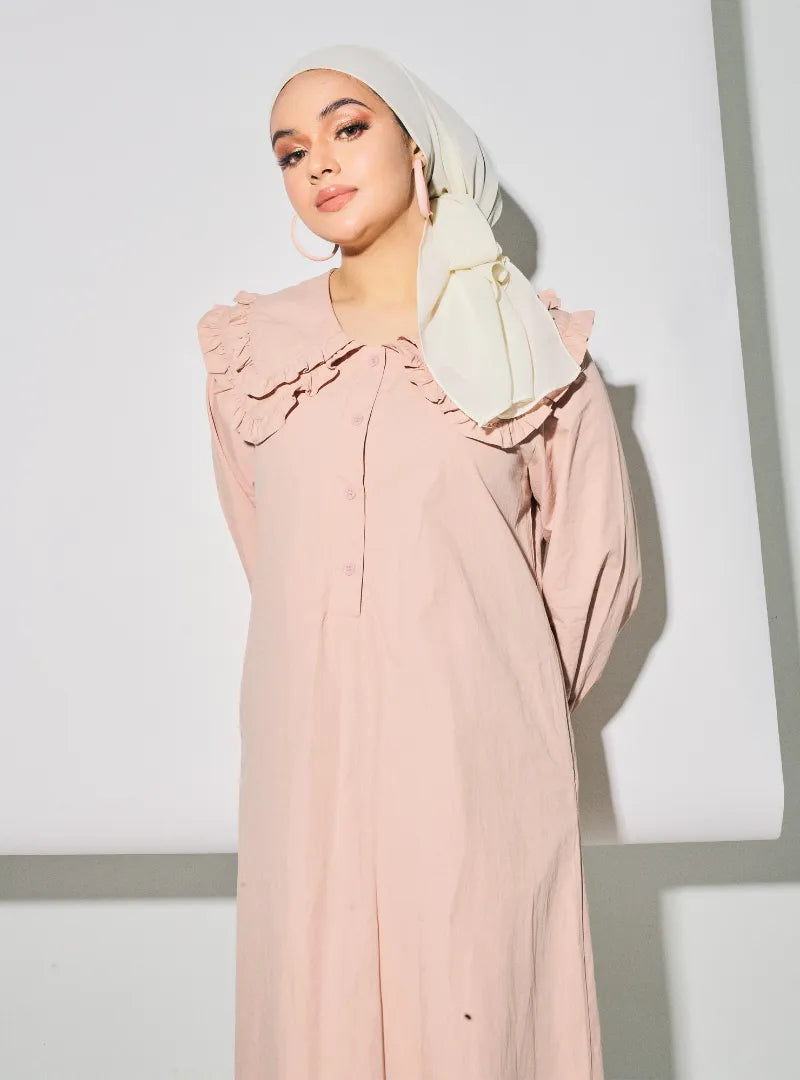 A woman dressed in Dusty Pink Marsya Cotton Long Sleeve Dress