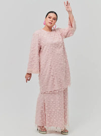 A woman dressed in Dusty Pink Tun Sharifah Lace Kurung