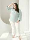 A woman dressed in Dusty Blue Jasper Mandarin Collar Basic Shirt