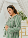 A woman dressed in Dusty Green Tun Natasha Eyelet Kurung Kedah Top