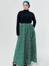 A woman wearing Emerald English Printed Cotton Maxi Skirt