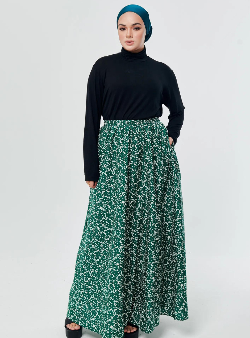 A woman wearing Emerald English Printed Cotton Maxi Skirt