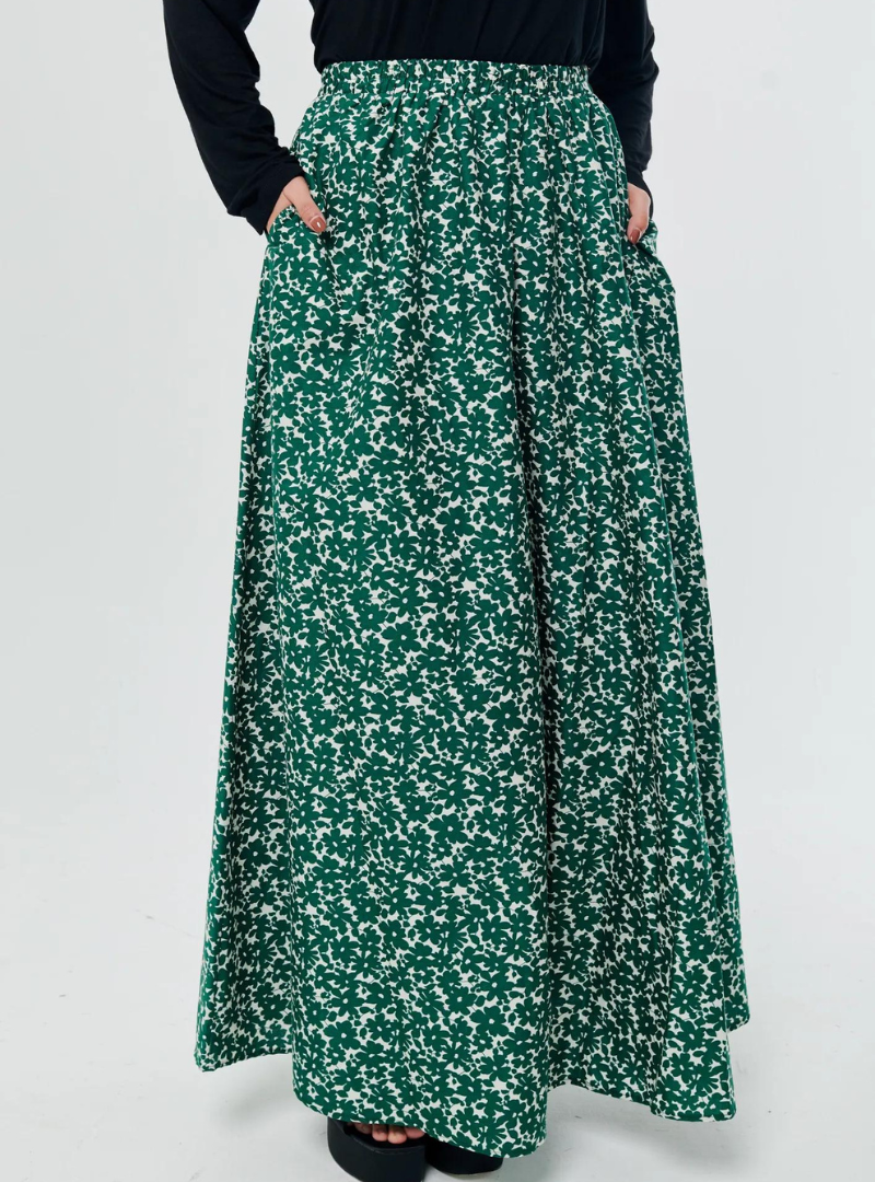 A woman wearing Emerald English Printed Cotton Maxi Skirt