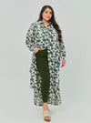 A woman dressed in Emerald Dandelion Longline Printed Shirt Dress