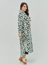 A woman dressed in Emerald Dandelion Longline Printed Shirt Dress