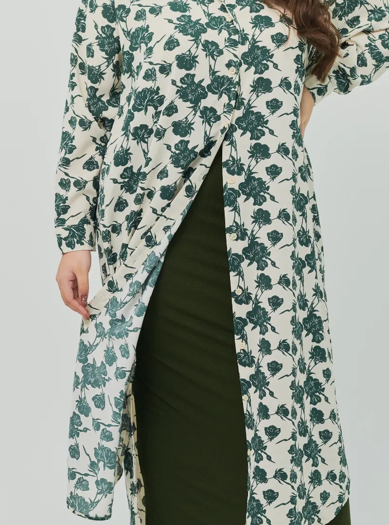 A woman dressed in Emerald Dandelion Longline Printed Shirt Dress