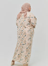 A woman dressed in Emerald Ranting The Vintage Opah Kurung