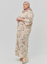 A woman dressed in Emerald Ranting The Vintage Opah Kurung