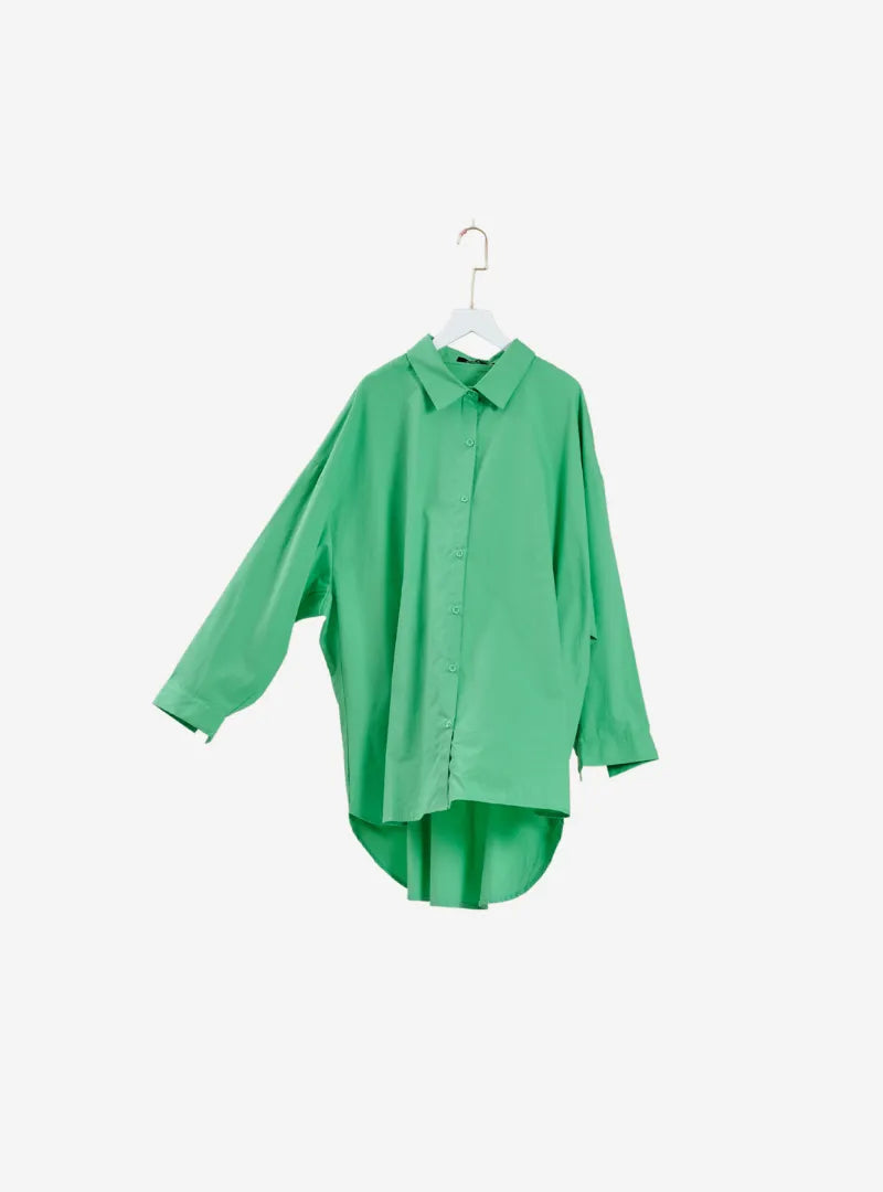 A woman dressed in Fern Dropped Shoulder Oversized Shirt